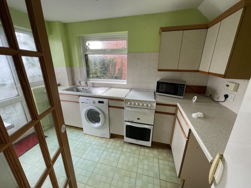 Lot: 78 - SEMI-DETACHED HOUSE IN POPULAR VILLAGE - Inside image of kitchen from dining area
